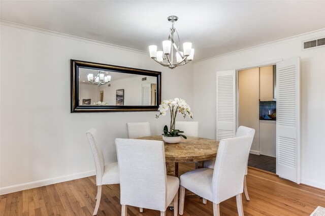 unfurnished bedroom with light wood-style flooring, visible vents, and baseboards