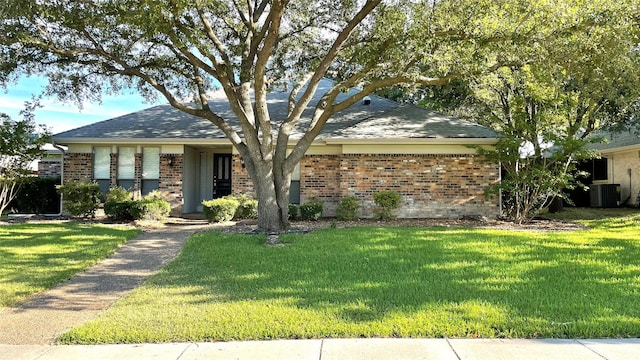 single story home with central AC and a front lawn