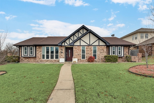 tudor-style house with a front yard