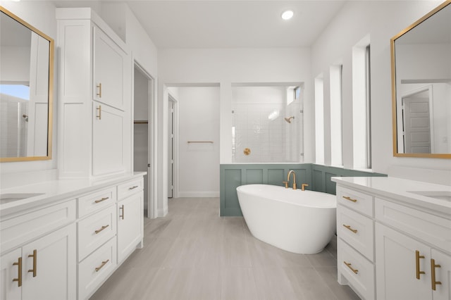 2301 Hawk Meadow Ct, Mansfield, TX 76063 - bathroom with a stall shower, vanity, a freestanding tub, and recessed lighting