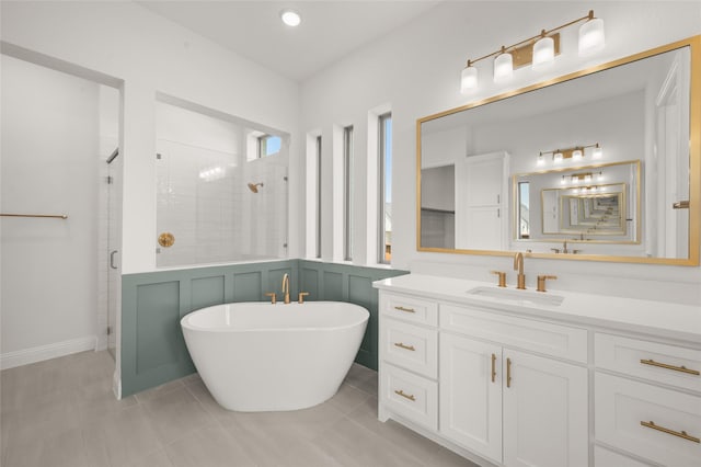 2301 Hawk Meadow Ct, Mansfield, TX 76063 - full bathroom with a stall shower, a freestanding bath, vanity, a decorative wall, and wainscoting