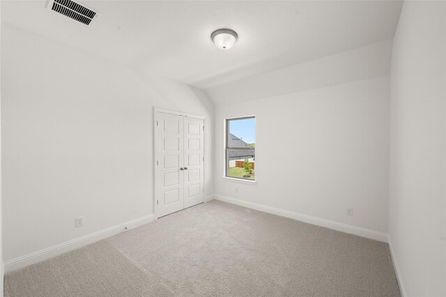 2301 Hawk Meadow Ct, Mansfield, TX 76063 - unfurnished bedroom featuring carpet, lofted ceiling, and a closet