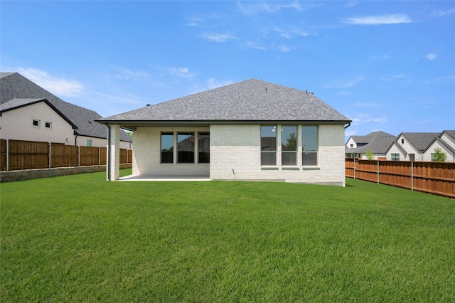 2301 Hawk Meadow Ct, Mansfield, TX 76063 - rear view of house featuring roof with shingles, a fenced backyard, a patio, and brick siding
