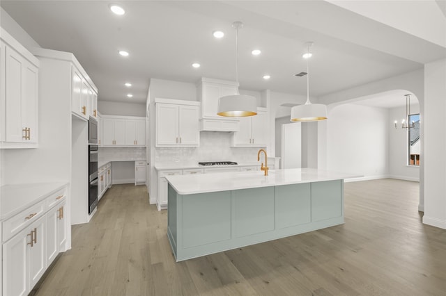 2301 Hawk Meadow Ct, Mansfield, TX 76063 - kitchen with gas stovetop, decorative backsplash, white cabinetry, light countertops, and recessed lighting