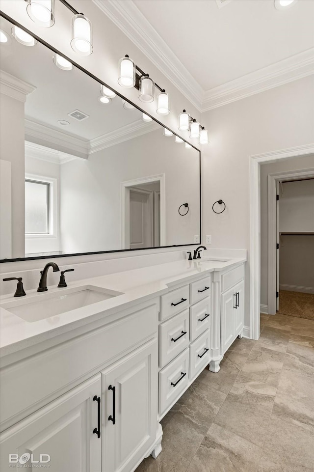 bathroom featuring ornamental molding and vanity