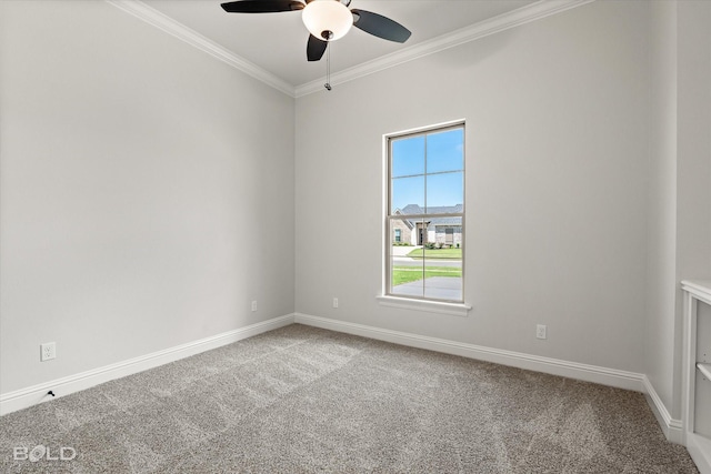 empty room featuring ornamental molding, carpet flooring, and ceiling fan