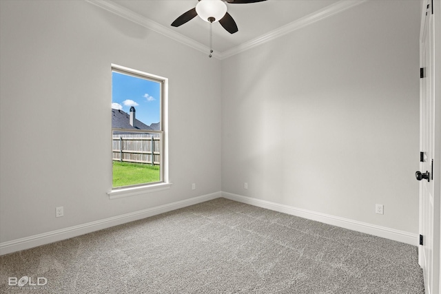 carpeted spare room featuring crown molding and ceiling fan