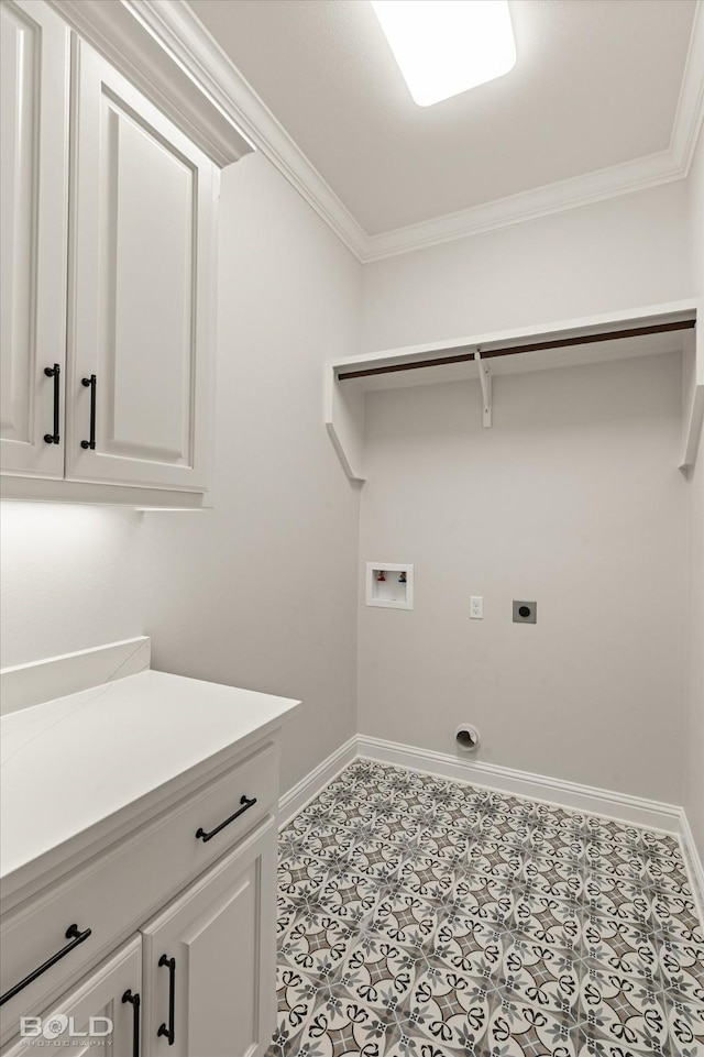 washroom with cabinets, ornamental molding, washer hookup, and electric dryer hookup