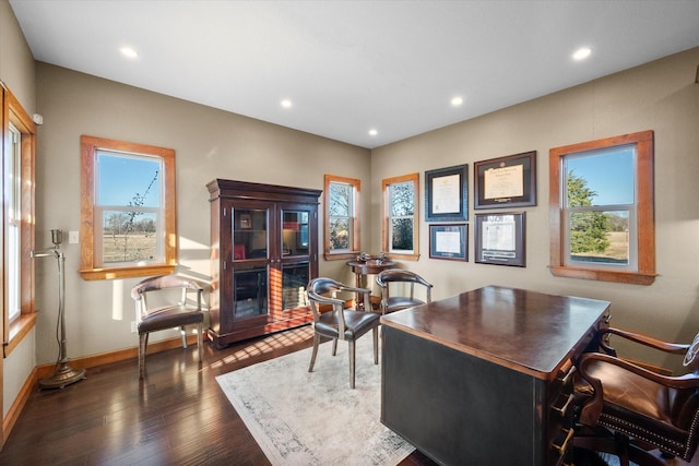 office area featuring a fireplace and dark hardwood / wood-style flooring