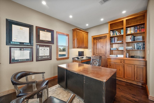 office space with dark wood-type flooring