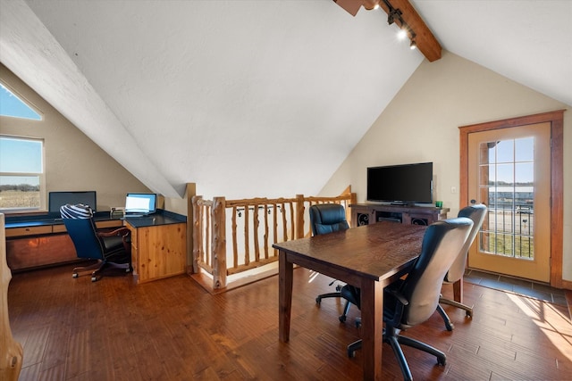 office space with hardwood / wood-style flooring, vaulted ceiling with beams, and track lighting