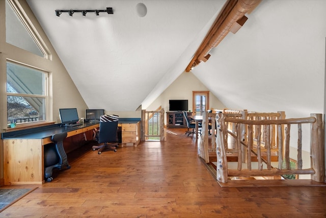 home office with vaulted ceiling with beams, hardwood / wood-style flooring, and rail lighting