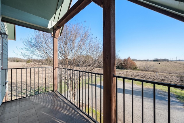 balcony featuring a rural view