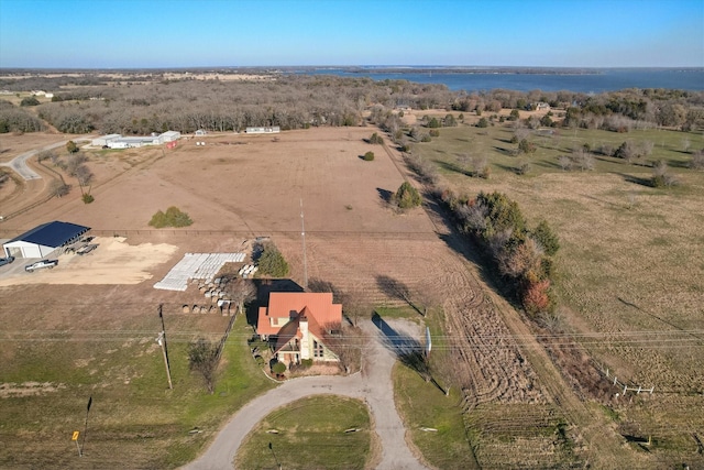 drone / aerial view featuring a rural view and a water view