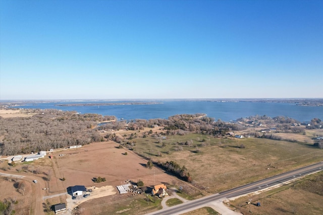 birds eye view of property with a water view and a rural view