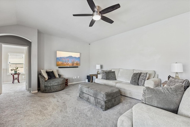 living room with vaulted ceiling, ceiling fan, and carpet floors