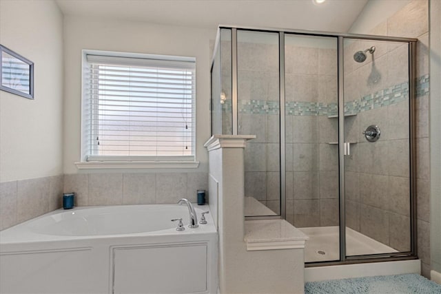 bathroom with shower with separate bathtub