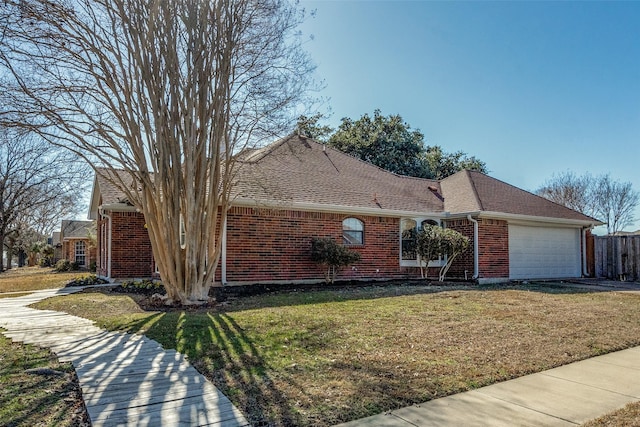 view of front facade with a garage and a front lawn