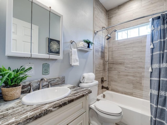 full bathroom featuring shower / tub combo, vanity, and toilet