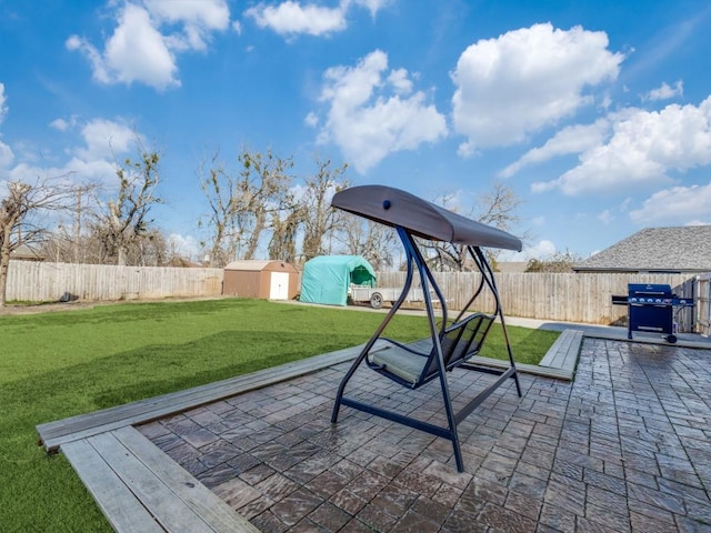 view of patio / terrace featuring a storage unit and a grill