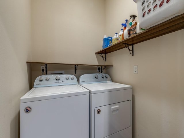 clothes washing area with separate washer and dryer