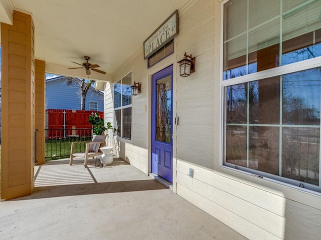 view of patio featuring ceiling fan and a porch