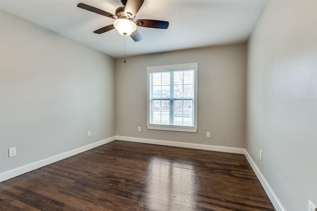 unfurnished room with ceiling fan and dark hardwood / wood-style floors