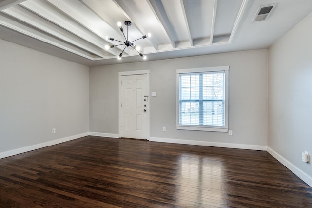 interior space with dark wood-type flooring, a notable chandelier, and beam ceiling