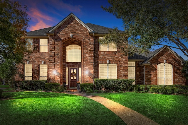 view of front property with a yard