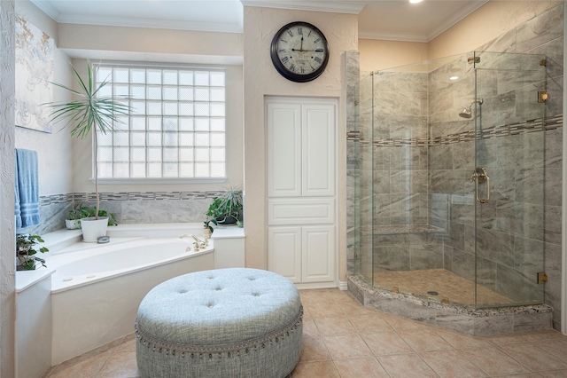 bathroom with tile patterned flooring, ornamental molding, and separate shower and tub