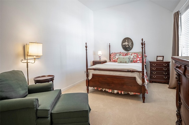 carpeted bedroom featuring vaulted ceiling