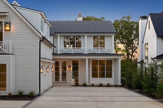 view of front of house featuring a balcony