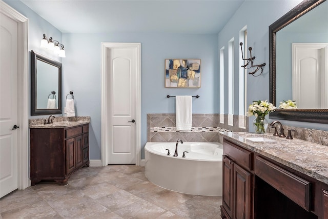 bathroom featuring vanity and a tub