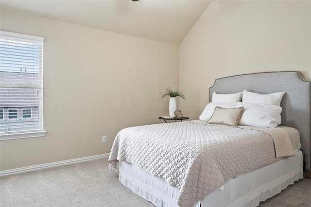 bedroom featuring vaulted ceiling and carpet flooring