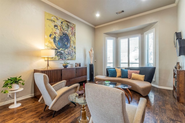 living area with crown molding and dark hardwood / wood-style floors