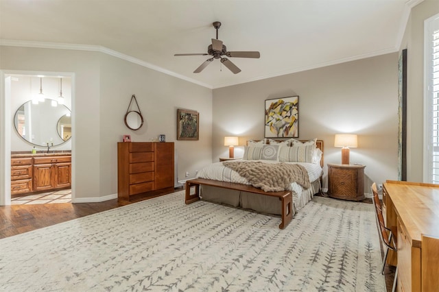 bedroom with crown molding, ceiling fan, connected bathroom, and light hardwood / wood-style floors