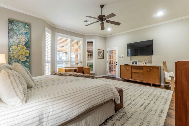 bedroom featuring ceiling fan, ornamental molding, and wood-type flooring