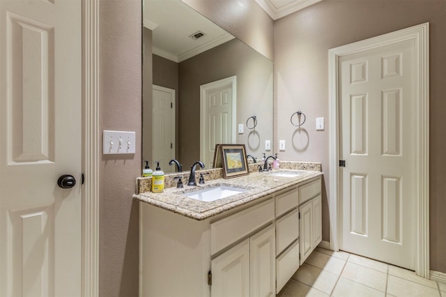 bathroom featuring vanity, tile patterned flooring, and crown molding