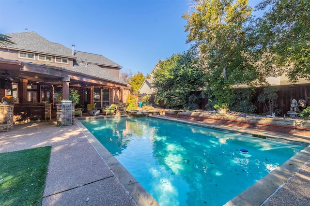 view of swimming pool with a patio