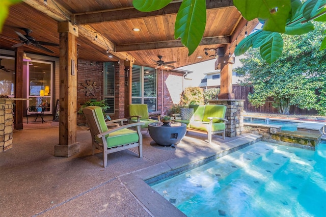 view of patio with a fenced in pool and ceiling fan