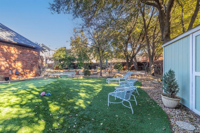 view of yard with a fenced in pool