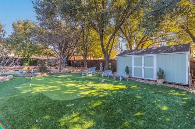 view of yard with a storage unit