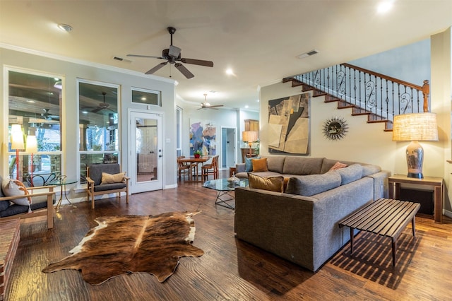 living room featuring crown molding and hardwood / wood-style floors