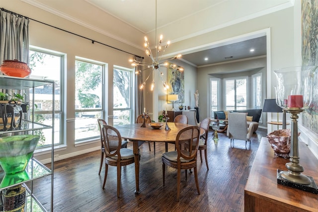 dining room featuring dark wood-type flooring, a healthy amount of sunlight, ornamental molding, and a notable chandelier