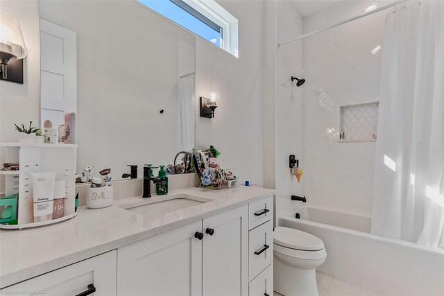 bathroom with shower / tub combo, toilet, and vanity