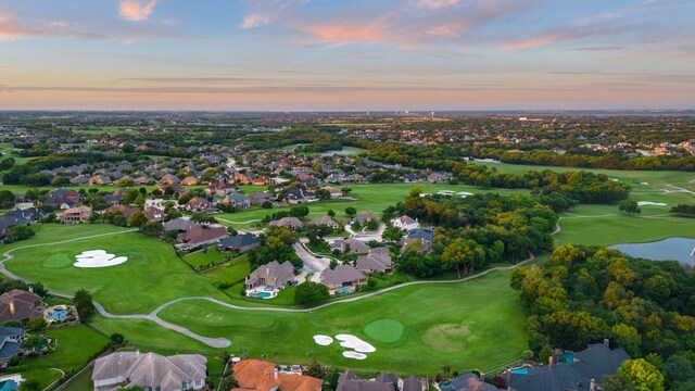 birds eye view of property featuring a residential view, a water view, and view of golf course
