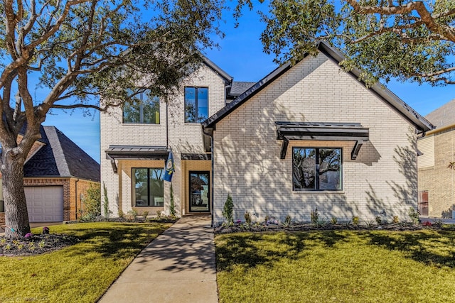 traditional home featuring brick siding and a front lawn