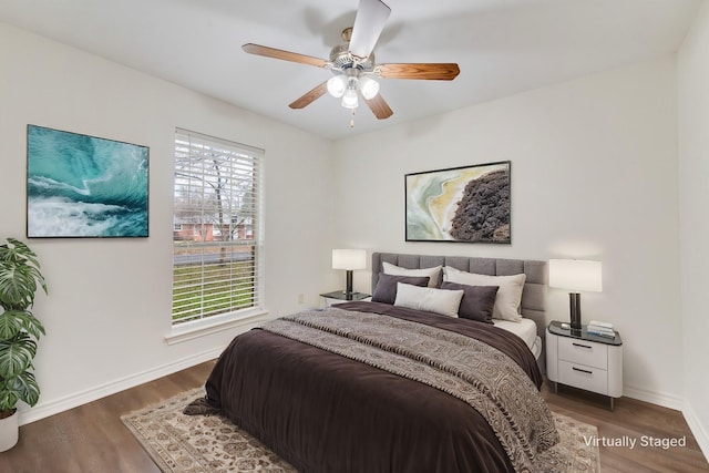 bedroom featuring ceiling fan and dark hardwood / wood-style flooring