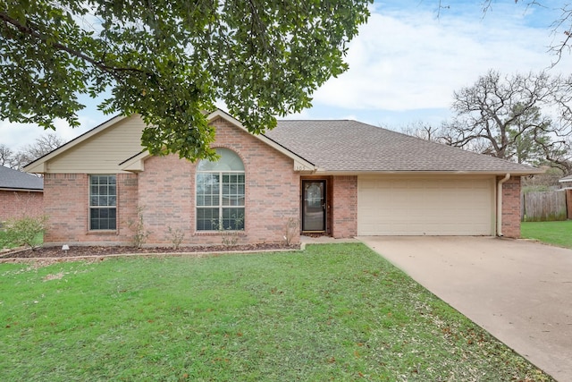 single story home with a garage and a front yard