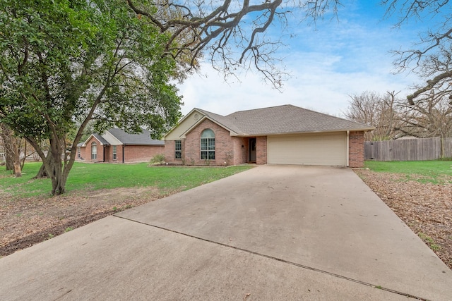 ranch-style house with a garage and a front yard